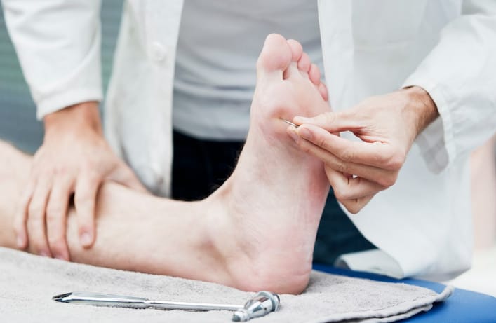 Specialist checking a patient's foot health