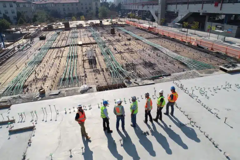Group of construction workers overlooking a work site