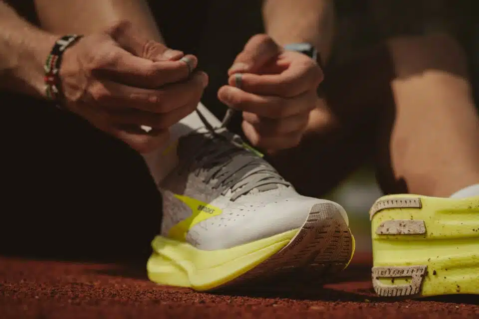 Running shoe with proper cushioning being tied up