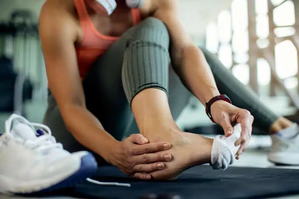 Athletic woman with foot pain