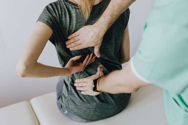 Woman experiencing back pain