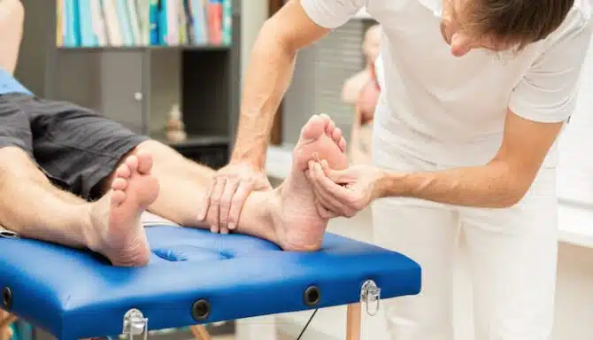 Specialist checking a patient's foot