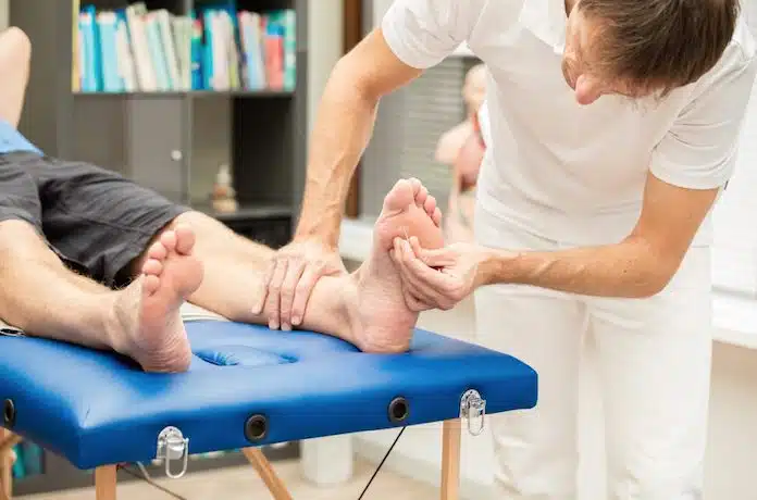 Specialist checking a patient's foot