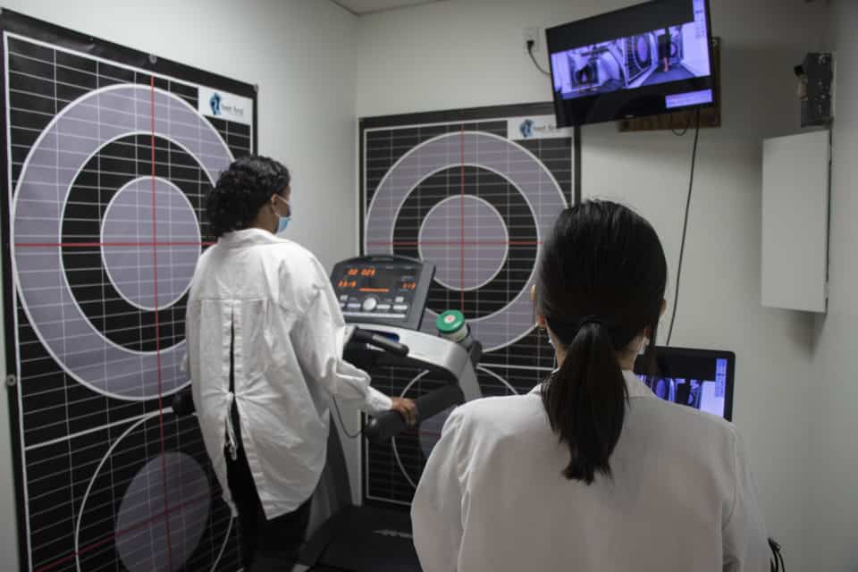 A chiropodist conducting a video gait analysis during a biomechanical assesment.