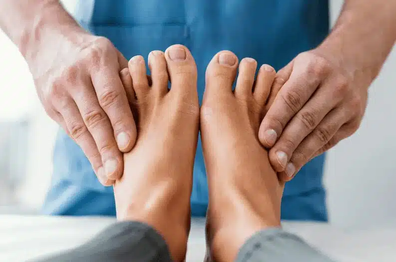 Specialist checking a patient's toes