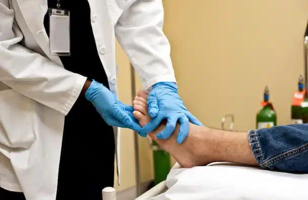 Specialist performing assessment of the foot