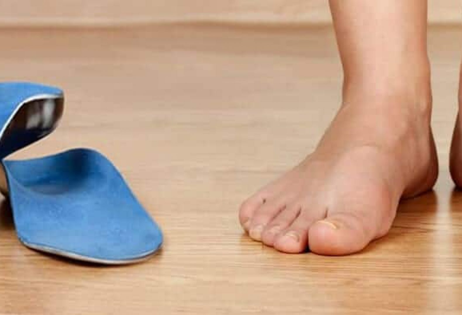 Custom Orthotics Next To A Person Standing