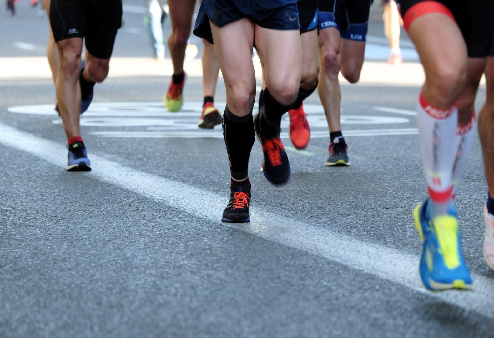 Close up of runner's shoes and feet during a road race