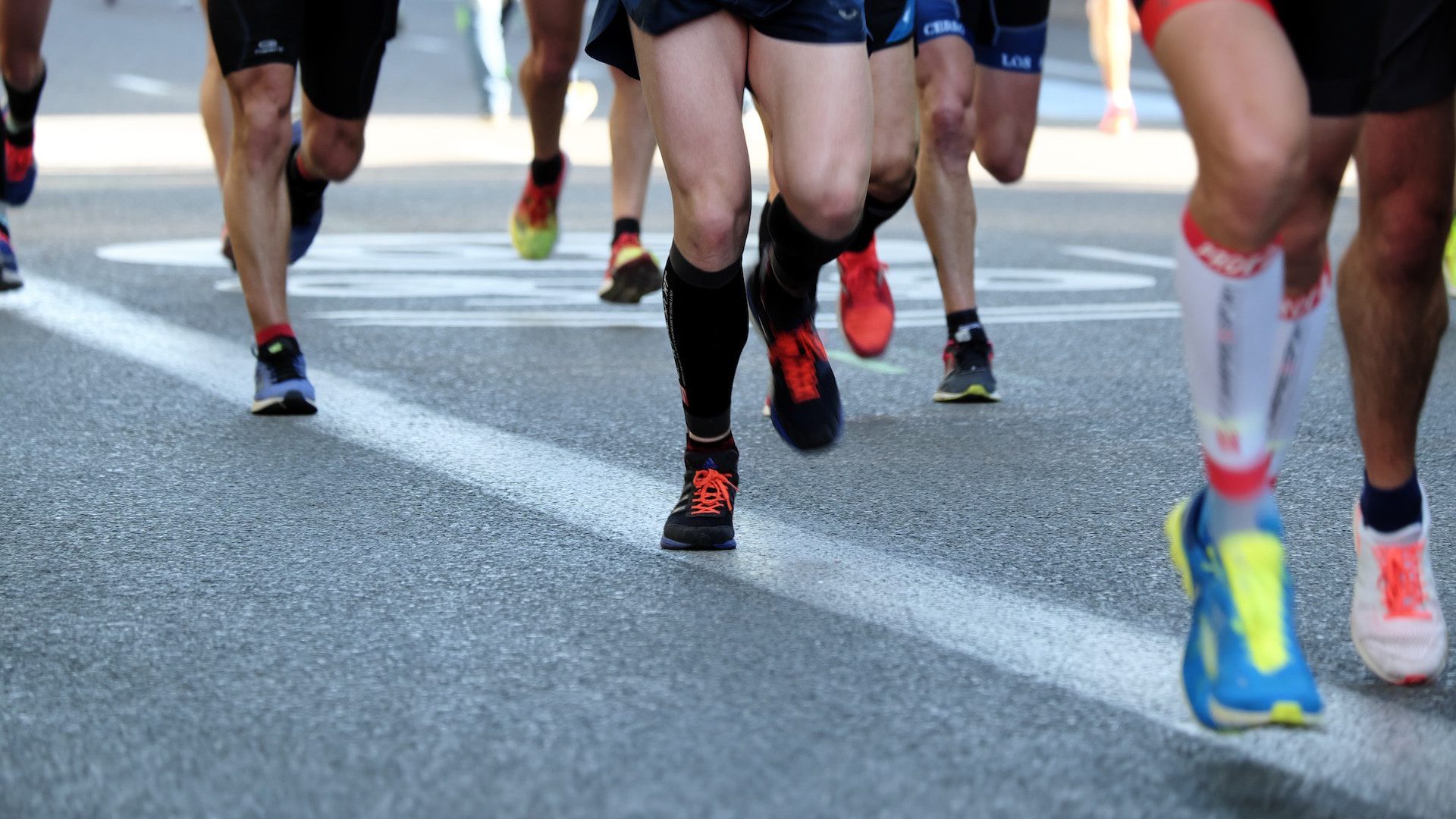 Close up of runner's shoes and feet during a road race