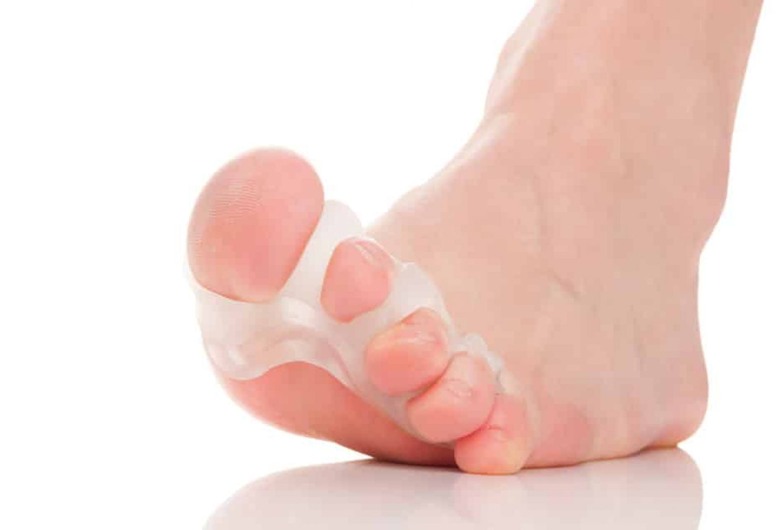close up of toe spacers and toes white background