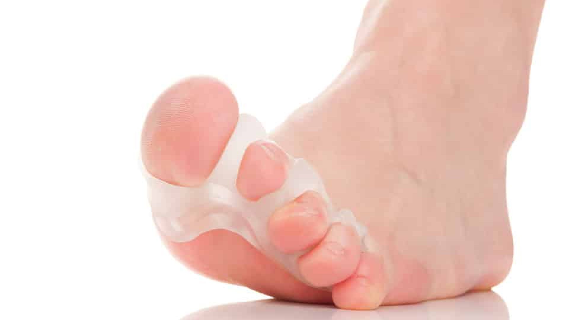 close up of toe separator device and toes white background