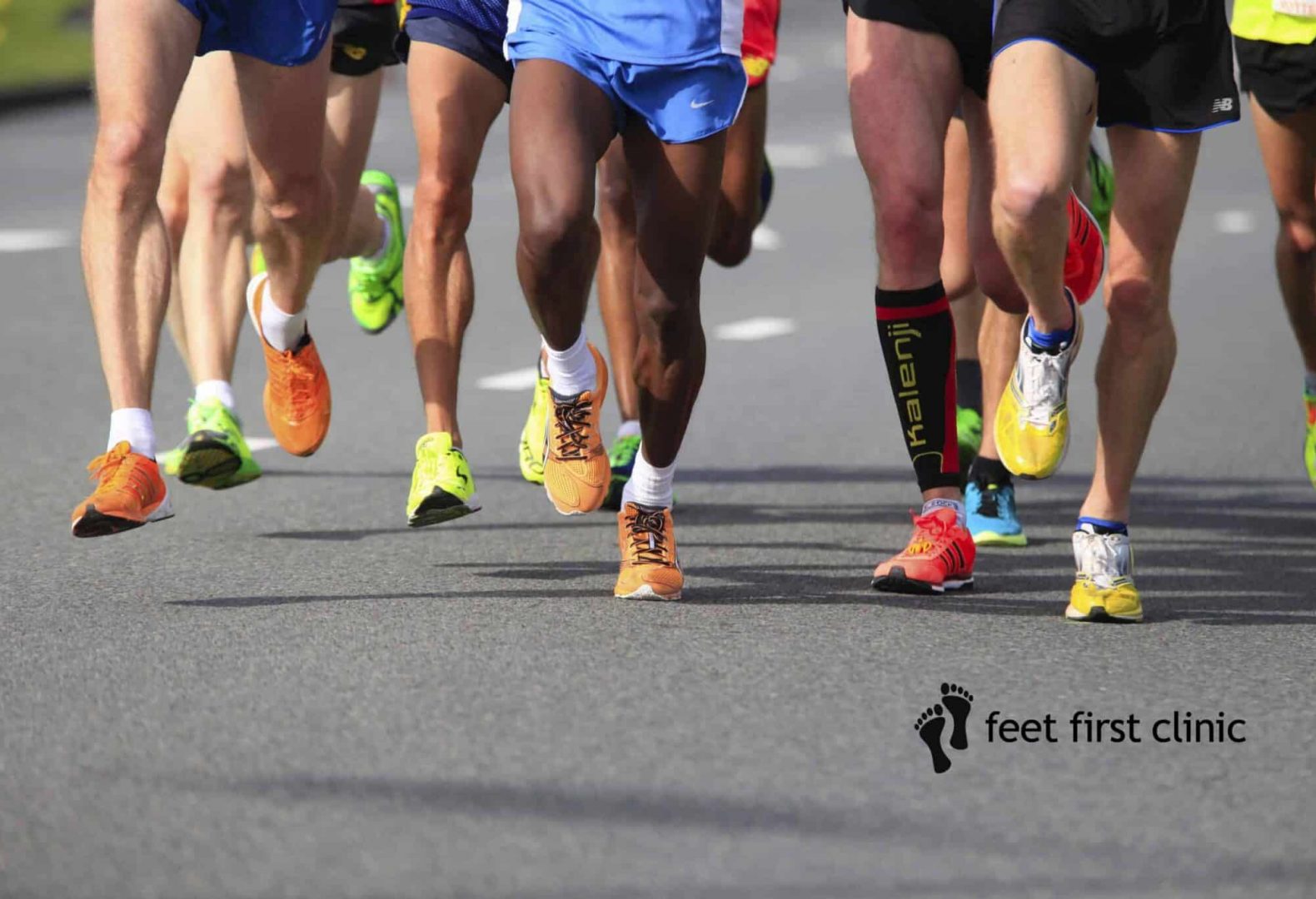 Rotterdam, Netherlands - April 12, 2015; legs and feet of athletes on sport shoes of brands like Saucony, Brooks and Adididas competing in the Rotterdam Marathon 2015.