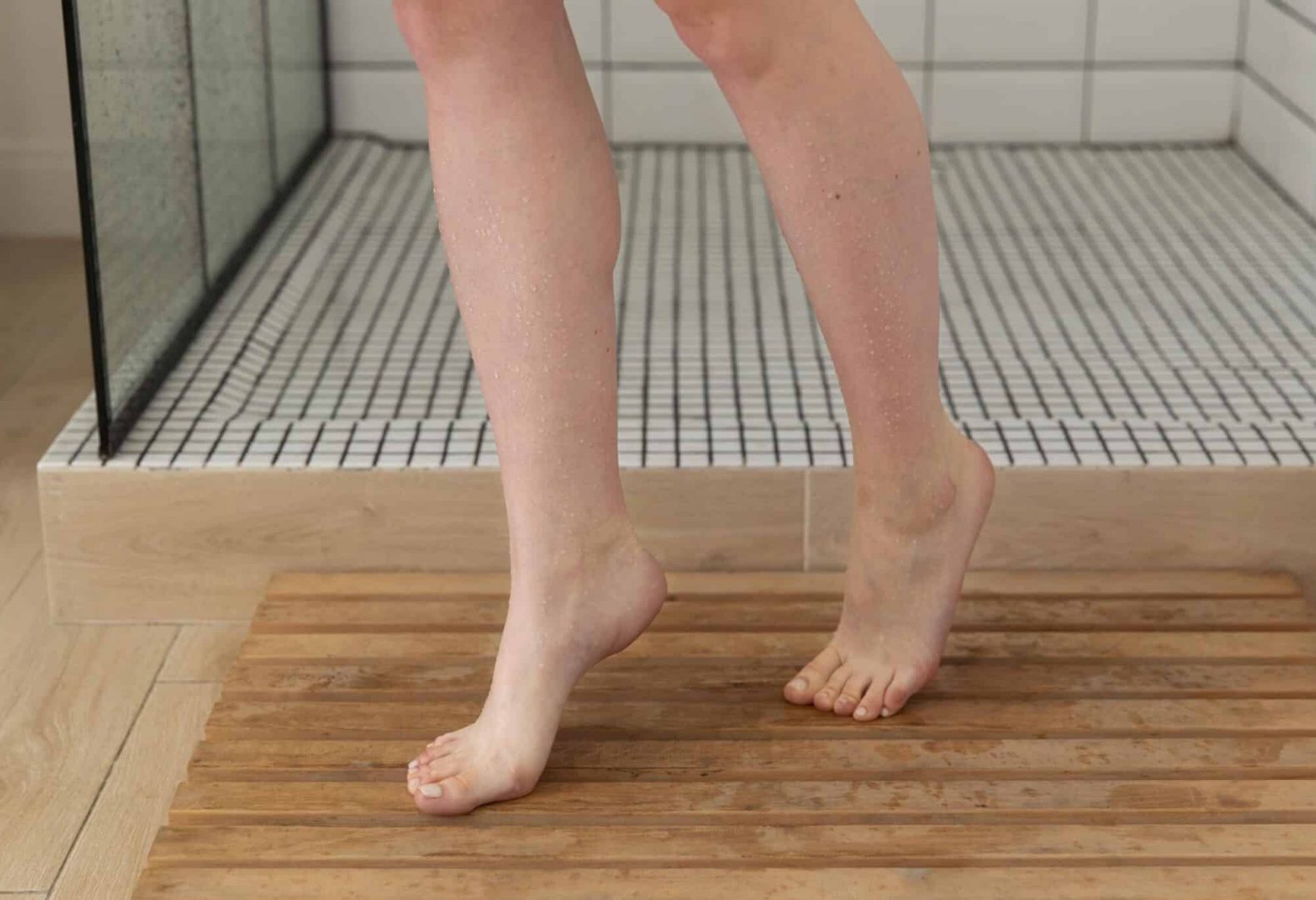 Woman with normal arches getting out of shower