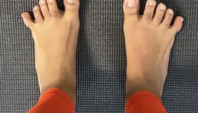 A foot doing a toe-spread exercise by spreading the toes apart.