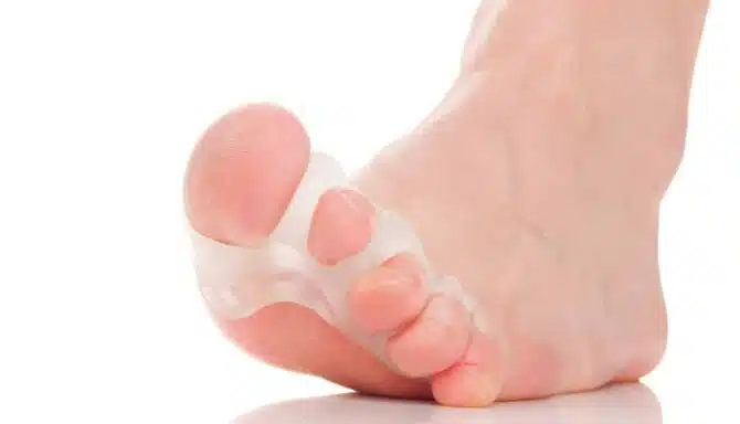 close up of toe spacers and toes white background
