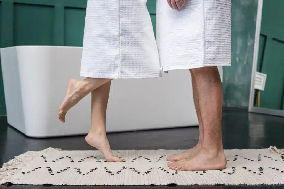 couple showing their clean feet in a spa setting
