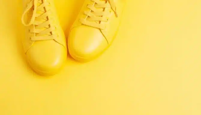 yellow shoes in front of a yellow background
