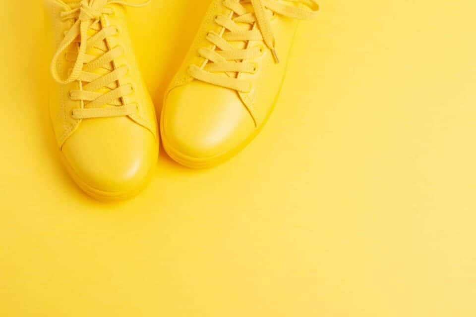 yellow shoes in front of a yellow background